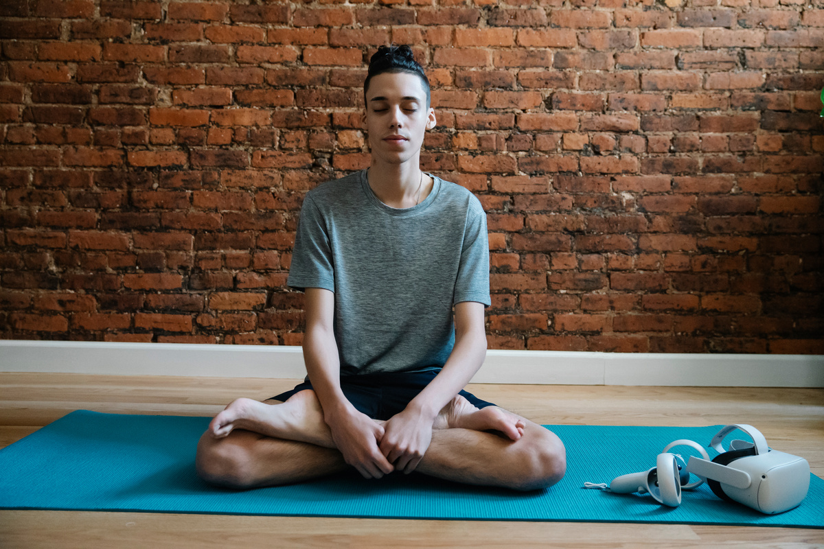 Teen meditating in lotus pose